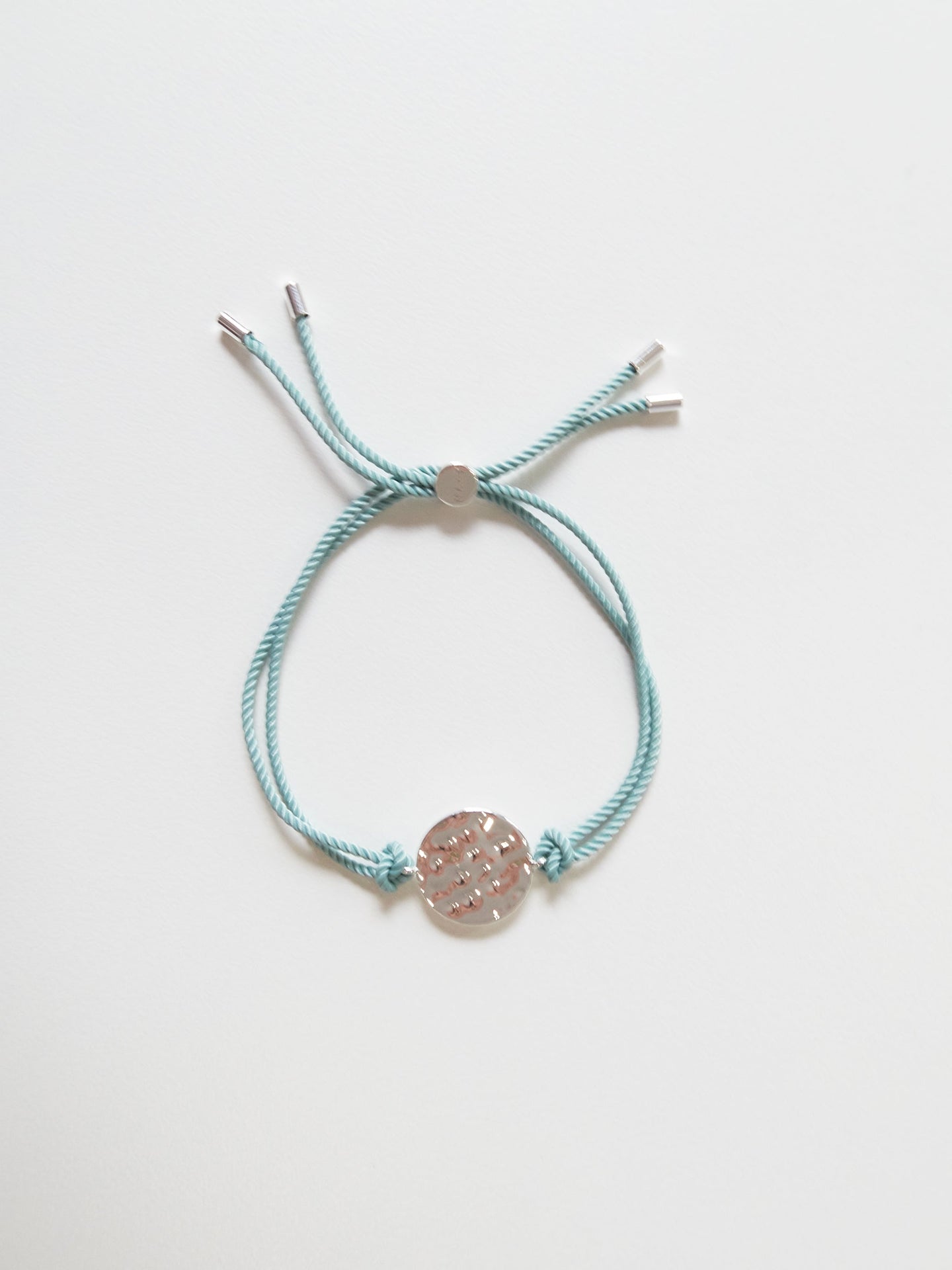 Silver bracelet with aqua tassel